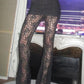 Black high rise flared trousers with lace insert