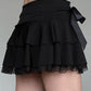 Black tiered mini skirt with lace bow