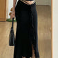 Black vintage midi skirt with low waist and ruffle trim