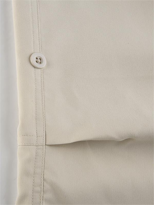 Light colored baggy parachute cargo pants with drawstring and low waist