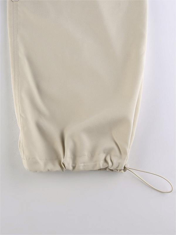 Light colored baggy parachute cargo pants with drawstring and low waist