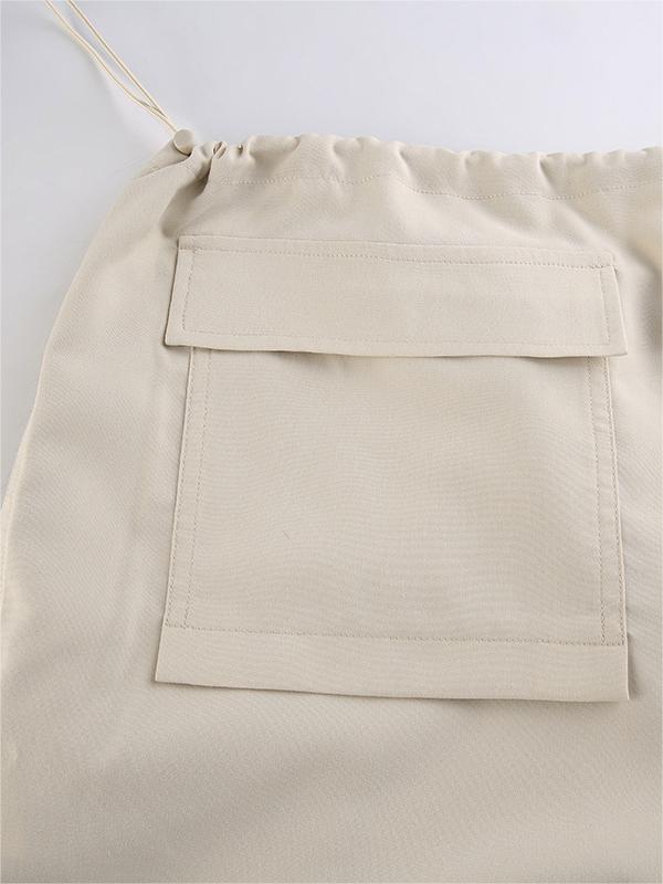 Light colored baggy parachute cargo pants with drawstring and low waist