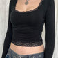 Black long sleeve crop top with square neckline and lace trim