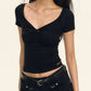 Black crop top with V-neck and short sleeves