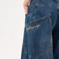 Vintage blue boyfriend jeans with large pockets and wide curved cut