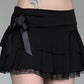 Black tiered mini skirt with lace bow