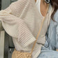 White vintage cut out knitted sweater with loose fit and V neck