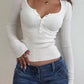 White basic rib knit top with button placket and long sleeves