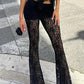 Black high rise flared trousers with lace insert