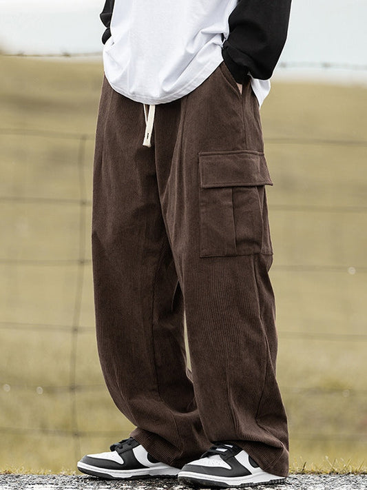 Brown vintage men's corduroy trousers with flap pockets and lacing