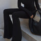 Black vintage jumpsuit with long sleeves and flared legs