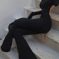 Black vintage jumpsuit with long sleeves and flared legs