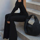 Black vintage jumpsuit with long sleeves and flared legs