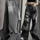 Black ripped boyfriend jeans with washed effect