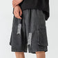 Dark grey vintage men's denim shorts with ripped pockets