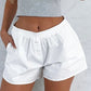 White retro button shorts