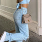 Light blue 2000s Y2k boyfriend jeans with ripped design