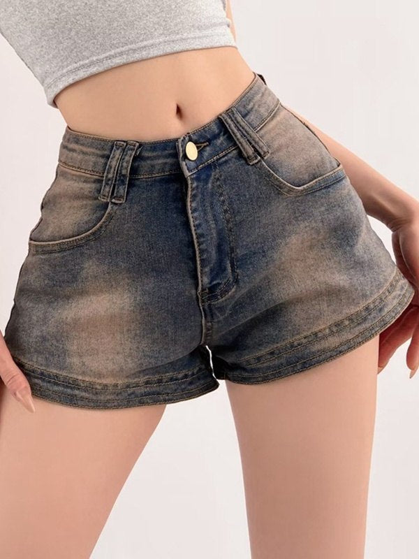 Blue vintage distressed denim shorts with washed effect