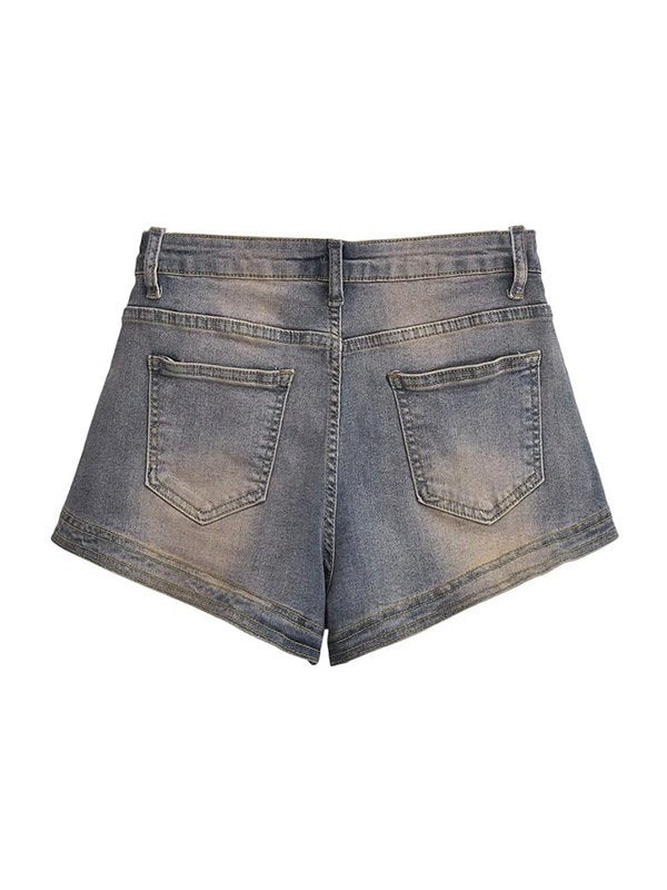 Blue vintage distressed denim shorts with washed effect