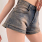 Blue vintage distressed denim shorts with washed effect