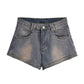 Blue vintage distressed denim shorts with washed effect