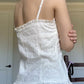 White vintage camisole with buttons and embroidered lace