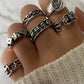 Set of 6 silver punk skull rings