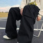 Men's baggy cargo pants with strap detail and pocket