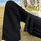 Men's baggy cargo pants with strap detail and pocket