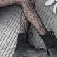 Fishnet tights with a spider web pattern