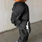 Black parachute trousers with cargo pockets and piping details