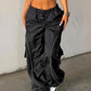 Black parachute trousers with cargo pockets and piping details