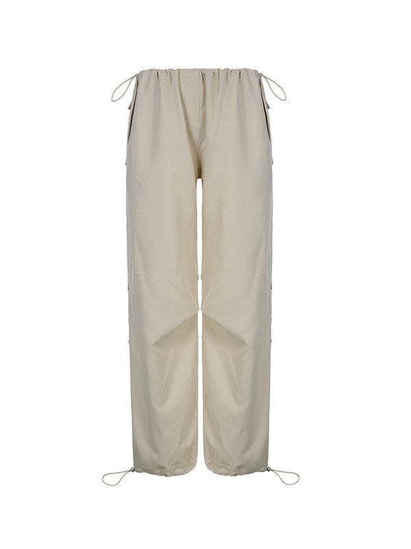 Light colored baggy parachute cargo pants with drawstring and low waist