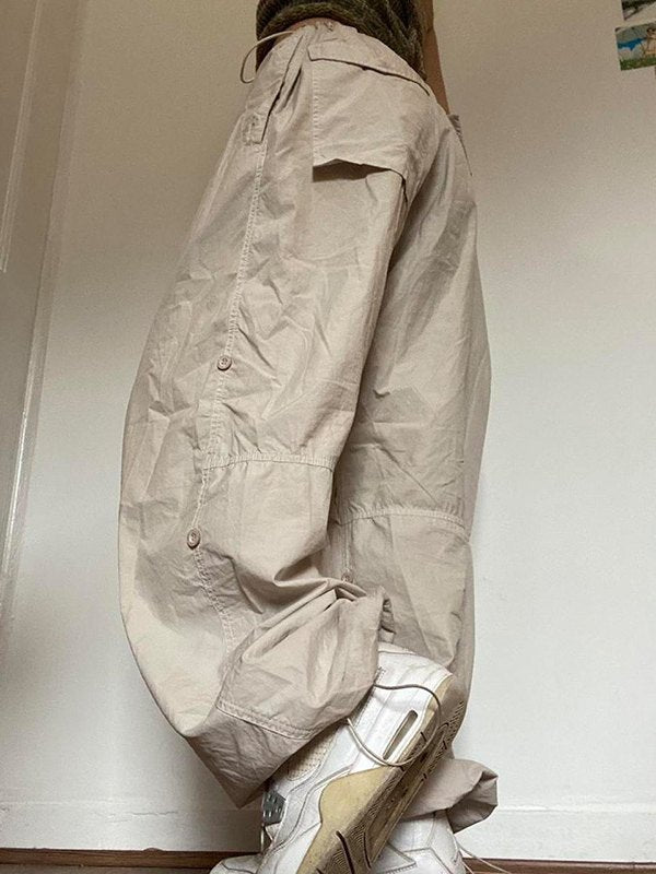 Light colored baggy parachute cargo pants with drawstring and low waist