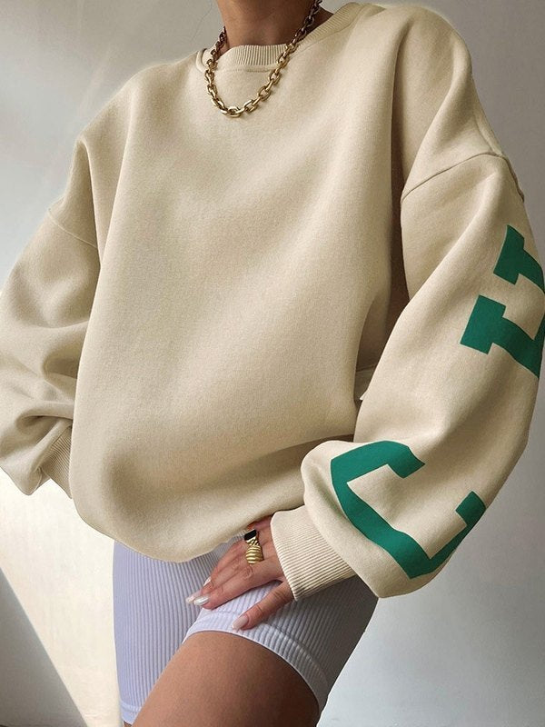 Oversized varsity sweatshirt with green letter graphic