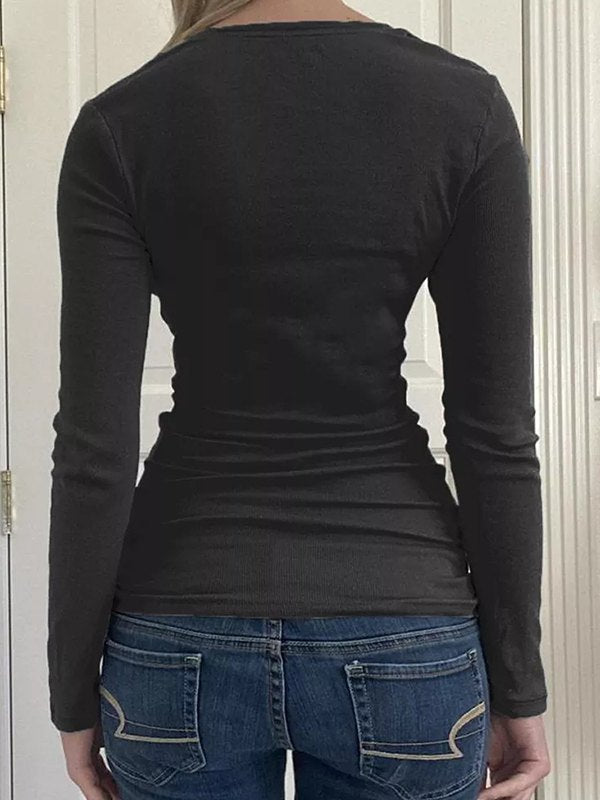 Black long-sleeved knit top with lace trim